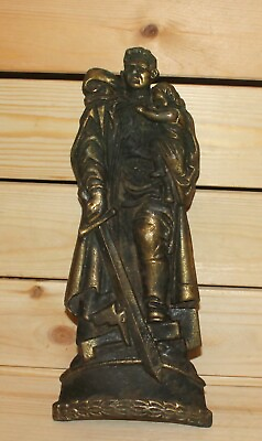 Vintage brass wall hanging statue of the Soviet soldier holding a child