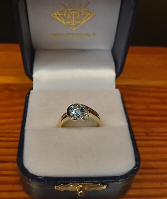#ad 1.00Ct. Sky Blue Topaz Flanked by Three Diamonds In 14K Yellow Gold
