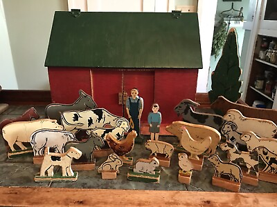 Wonderful Old Wooden Handmade Barn and German farm animals on wooden stands..