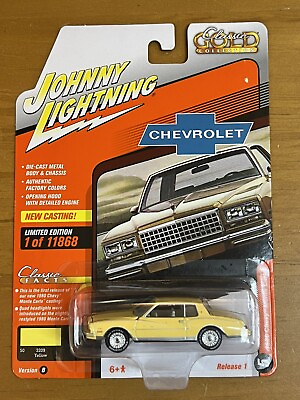 #ad Johnny Lightning Classic Gold 1980 Chevy Monte Carlo Chase White Interior New